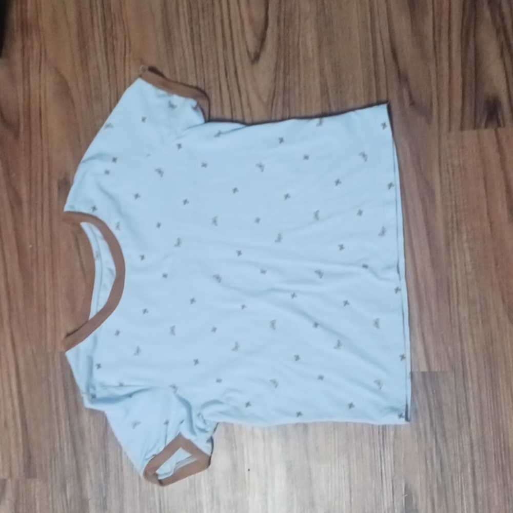 blue shirt with brown butterflies